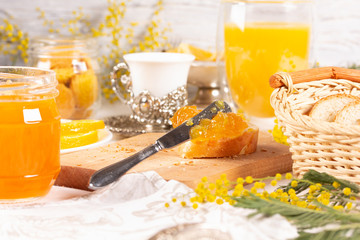 Orange jam with white bread on the table