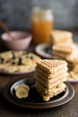 Waffles with various fruits and maple syrup