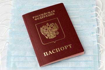Passport of citizen Russian Federation on background of protective antivirus face masks for....