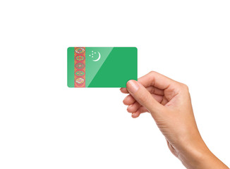 Beautiful hand holding Turkmenistan flag card on white background