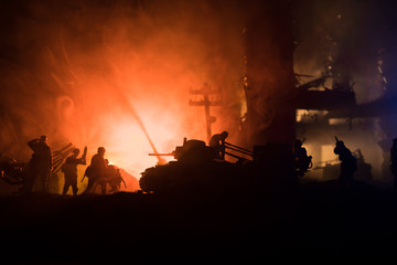 War Concept. Military silhouettes fighting scene on war fog sky background, World War Soldiers Silhouette Below Cloudy Skyline At night.