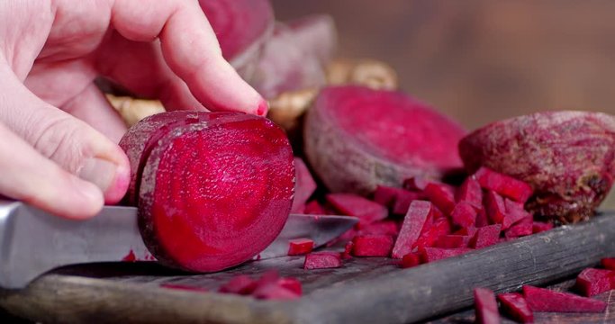 Sliced fresh beets on a cutting Board.