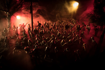 War Concept. Military silhouettes fighting scene on war fog sky background, World War Soldiers Silhouette Below Cloudy Skyline At night.