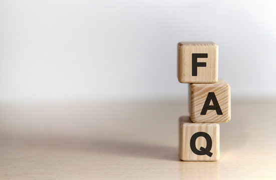 FAQ - text on wooden cubes, on wooden background