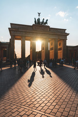 Berlin, Brandenburg gate with tourist in silhouette at sunset © william87