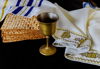 Jewish holiday passover matzot and tallit the substitute for bread on the Jewish kosher wine over...