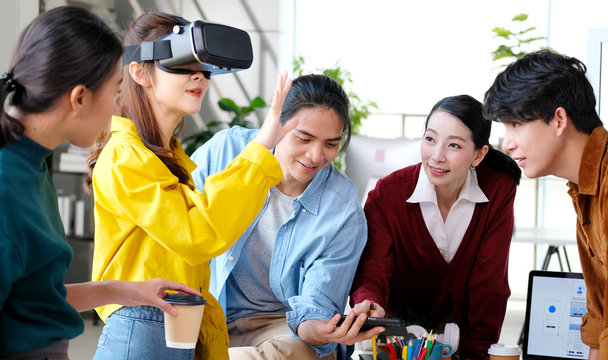 VR mobile phone application test, Asian woman with virtual reality headset in VR experience, Young asia business team developers reality simulator smartphone app test, ux, ui startup, small business