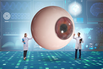 Doctor examining giant eye in medical concept