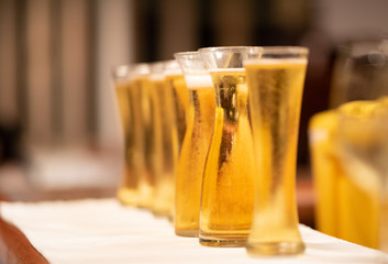 cold beer glass on bar counter with free space