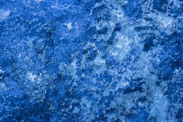 Fototapeta na wymiar Granite texture tinted in classic blue color.