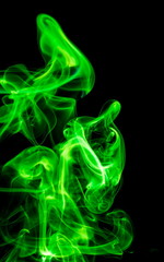Green smoke on black background