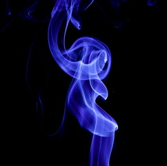 Blue smoke on black background