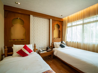 Luxury room with bed in warm light, India style,