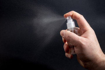 Alcohol spray from a bottle to desinfect surfaces and items.