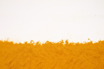 Turmeric powder isolated on a white background is an ingredient in turmeric foods and ingredients in skin care products. Turmeric helps the skin to be strong.
