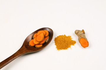 Turmeric powder and fresh turmeric roots isolated on a white background are ingredients in turmeric foods and ingredients in skin care products. Turmeric helps the skin to be strong.