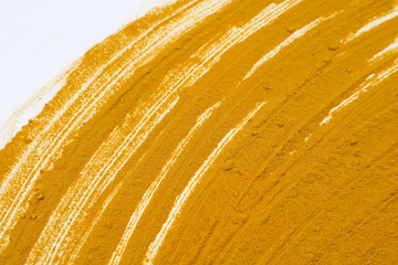 Turmeric powder isolated on a white background is an ingredient in turmeric foods and ingredients in skin care products. Turmeric helps the skin to be strong.