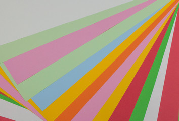 Color papers geometry flat composition background with rainbow tones