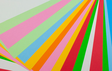 Color papers geometry flat composition background with rainbow tones