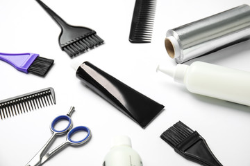 Professional tools for hair dyeing on white background