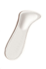 Isolated orthopedic insole on a white background. Treatment and prevention of flat feet and foot diseases. Foot care, comfort for the feet. Wear comfortable shoes. Medical insoles.