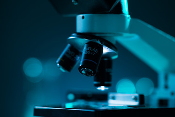 Close-up of scientific microscope. Laboratory in hospital. Epidemic disease, healthcare, vaccine research and coronavirus 2019-ncov test.