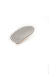 Orthopedic silicone heel from corns for the correction of different lengths of legs isolated on white background