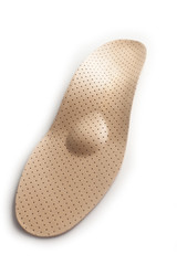 Isolated orthopedic insole on a white background. Treatment and prevention of flat feet and foot diseases. Foot care, comfort for the feet. Wear comfortable shoes. Medical insoles.