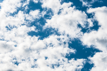 White clouds in a bright blue sky. The beauty of the nature