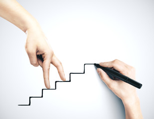 Hand climbing on drawing stairs.