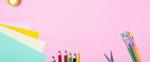 Fototapeta premium Banner Bright Watercolours, Brushes, blank colored paper on pink background. Free space. School begins art concept