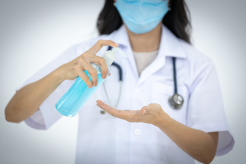 The female doctor taught how to wash hands properly with alcohol gel. To prevent covid-19, corona ,...