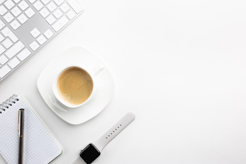 Cup of coffee with office tools on light background, office flat lay