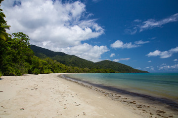 Fototapeta na wymiar Cape Tribulation, Queensland, Australia. No people at a beautiful lonely beach, but the water is too dangerous to go in.