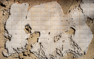 Dry cement texture with the pattern of a broken tile. Under construction concept.