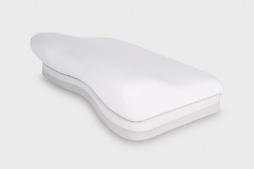 Orthopedic Pillow with a Memory Effect. Medical treatment pillow for sleep. Comfort Memory Pillow under the head with a recess under the shoulder isolated on white background. Sleeping Support Pillow