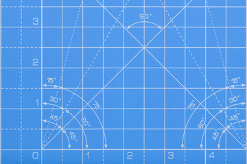 Isolated background segment of blue cutting mat with measurements and angles in white. Concept for engineering, invention, science, education or hobby.