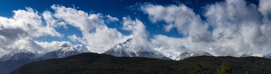 Panoramic Canadian Landscape View of the fog covered valley during a cloudy day. Taken in Tantalus Lookout near Squamish and Whistler, North of Vancouver, BC, Canada. Background Panorama