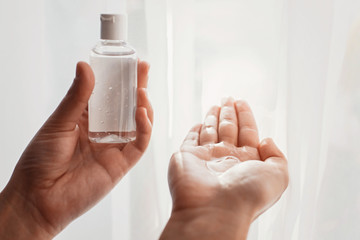 Hands disinfection. Applying disinfection alcohol gel on hands palm  to prevent virus epidemic. Prevention of flu disease and coronavirus. Cleaning and disinfecting hands in proper way.