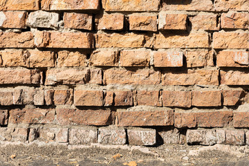 Texture. Part of wall surface from a torn red brick