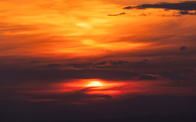 Beautiful colorful bright sunset sky with orange clouds. Nature sky background. 