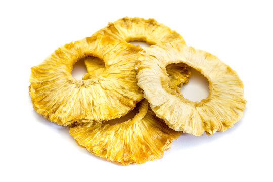 Dried pineapple rings isolated on white