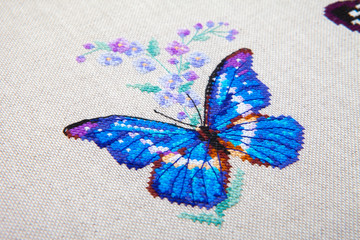 Naklejka na ściany i meble butterfly and flower pattern embroidered on fabric