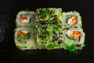 Japanese food: Set of salmon sushi and rolls with salmon and eel