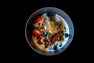 yogurt with berries, strawberries, pumpkin seeds and sesame