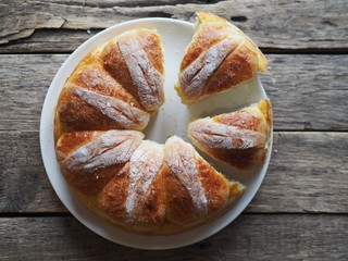Festive Easter, Christmas or everyday bread rolls on a wooden rustic ancient table.Homemade cake. The view from the top.
