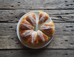 Festive Easter, Christmas or everyday bread rolls on a wooden rustic ancient table.Homemade cake. The view from the top.