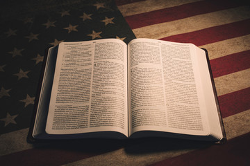 Holy Bible on a vintage American Flag - 330559379