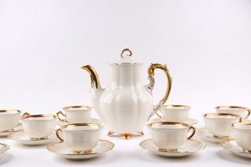 vintage coffee set of white porcelain tableware on white background