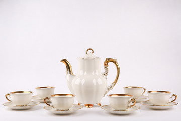 vintage coffee set of white porcelain tableware on white background